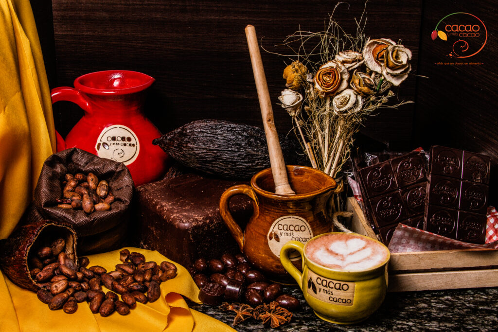 Cacao y Mas Cacao branded pitcher and cup with cacao pod and chocolate bars