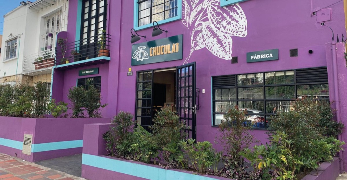 Chuculat purple and teal Chapinero storefront with cacao-pod mural